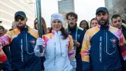 Baerbock trägt olympische Fackel für UN bei Winterspiel-Eröffnung in Mailand
