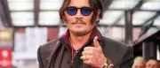 Johnny Depp überrascht als griesgrämiger Ebenezer Scrooge bei Comic-Con